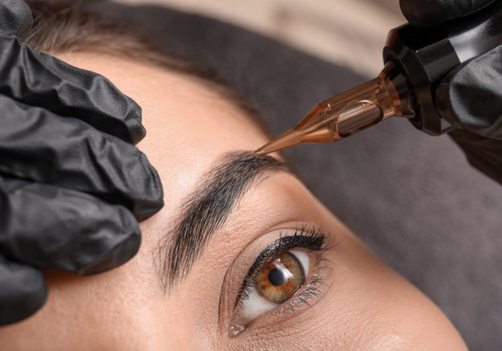 permanent-makeup-artist-applying-tattoo-to-eyebrow-2026-01-12-17-07-54-utc-scaled.jpg